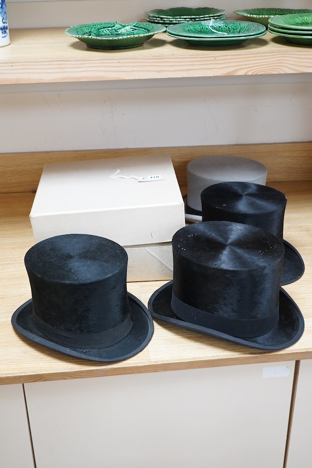 Three gentlemen’s black silk top hats and a similar grey top hat and box. Condition - grey hat good, others poor